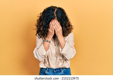 Middle Age Hispanic Woman Wearing Casual Clothes With Sad Expression Covering Face With Hands While Crying. Depression Concept. 