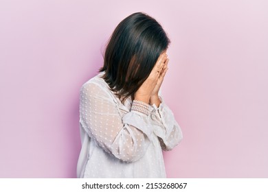 Middle Age Hispanic Woman Wearing Casual Clothes With Sad Expression Covering Face With Hands While Crying. Depression Concept. 