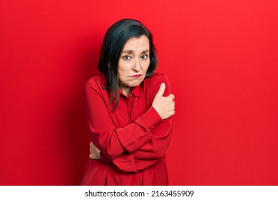 Middle Age Hispanic Woman Wearing Casual Clothes Shaking And Freezing For Winter Cold With Sad And Shock Expression On Face 