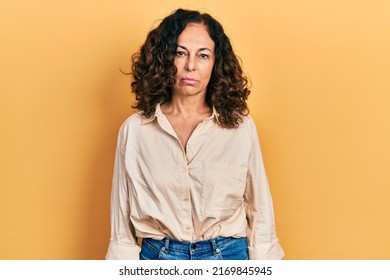 Middle Age Hispanic Woman Wearing Casual Clothes Depressed And Worry For Distress, Crying Angry And Afraid. Sad Expression. 