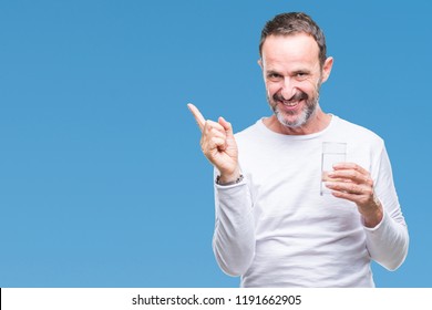 Middle Age Hoary Senior Man Drinking Glass Of Water Over Isolated Background Very Happy Pointing With Hand And Finger To The Side