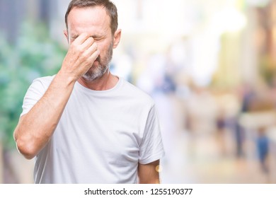 Middle Age Hoary Senior Man Wearing White T-shirt Over Isolated Background Tired Rubbing Nose And Eyes Feeling Fatigue And Headache. Stress And Frustration Concept.