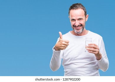 Middle Age Hoary Senior Man Drinking Glass Of Water Over Isolated Background Happy With Big Smile Doing Ok Sign, Thumb Up With Fingers, Excellent Sign