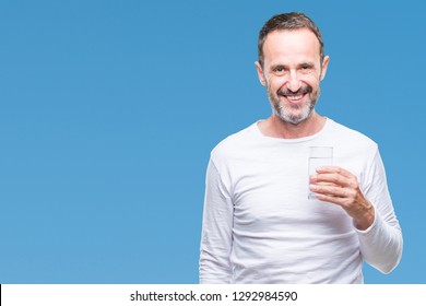 Middle Age Hoary Senior Man Drinking Glass Of Water Over Isolated Background With A Happy Face Standing And Smiling With A Confident Smile Showing Teeth