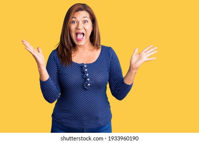 Middle Age Latin Woman Wearing Casual Clothes Celebrating Victory With Happy Smile And Winner Expression With Raised Hands 