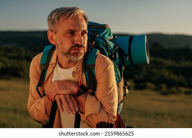 Middle Age Male Hiker, Enjoying The Day Out In The Mountains, Taking A Rest After Long Walk.