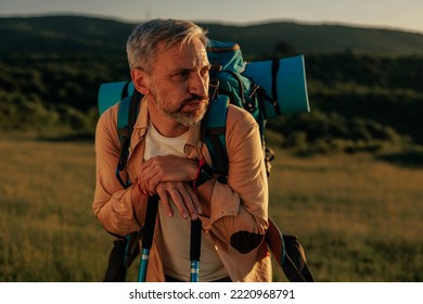 Middle Age Male Hiker, Enjoying The Day Out In The Mountains, Taking A Rest After Long Walk.