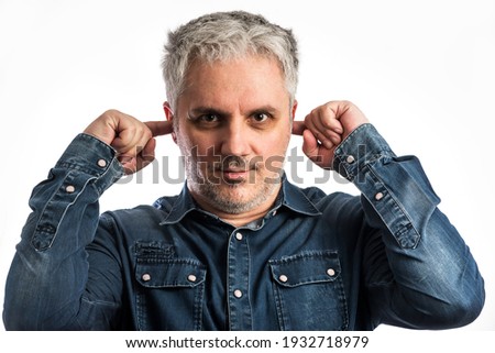 Similar – Portrait of man covering an eye with his hand