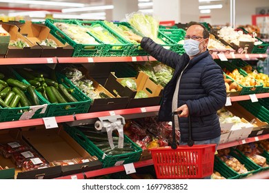 Middle Age Man Buying Food In Grocery Store, Wearing Medical Mask