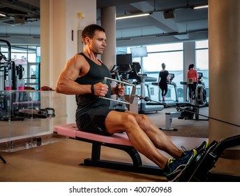 Middle Age Man Doing Workout In A Gym Club.