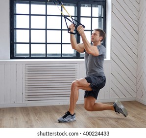 Middle age man doing workouts in a room with big window. - Powered by Shutterstock