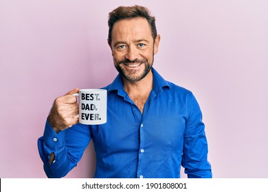 Middle Age Man Drinking Mug Of Coffee With Best Dad Ever Message Looking Positive And Happy Standing And Smiling With A Confident Smile Showing Teeth 