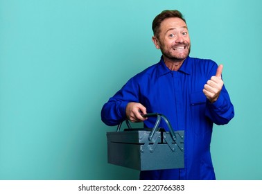 Middle Age Man Feeling Proud,smiling Positively With Thumbs Up. Plumber With A Toolbox Concept