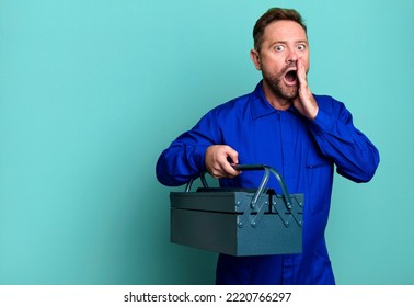 Middle Age Man Feeling Shocked And Scared. Plumber With A Toolbox Concept