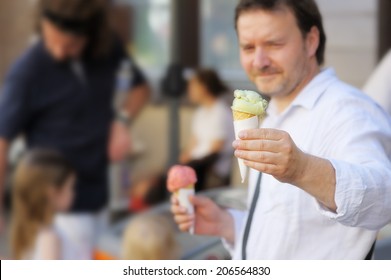 Middle Age Man Holding Ice Cream