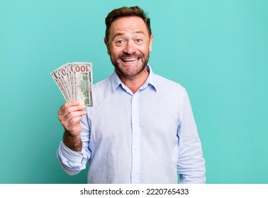 Middle Age Man Looking Happy And Pleasantly Surprised. Dollar Banknotes Concept