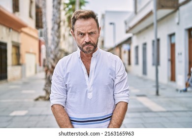 Middle Age Man Outdoor At The City Skeptic And Nervous, Frowning Upset Because Of Problem. Negative Person. 