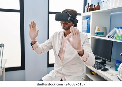 Middle age man scientist using virtual reality glasses at laboratory - Powered by Shutterstock