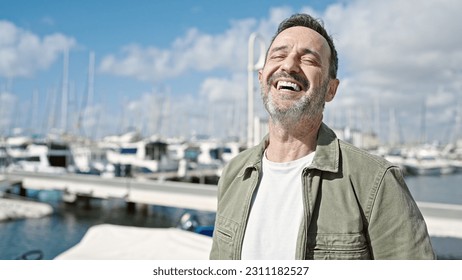 Middle age man smiling confident standing at port - Powered by Shutterstock