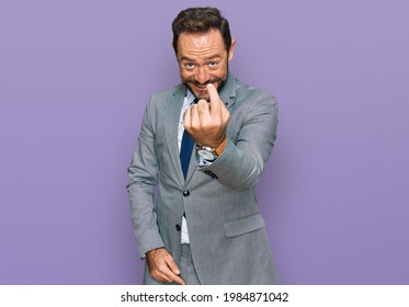 Middle Age Man Wearing Business Clothes Beckoning Come Here Gesture With Hand Inviting Welcoming Happy And Smiling 