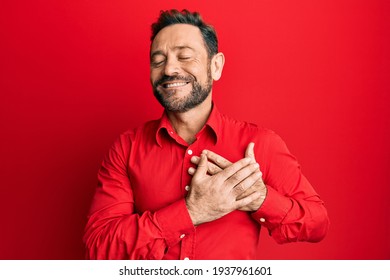 Middle age man wearing casual clothes smiling with hands on chest, eyes closed with grateful gesture on face. health concept. 