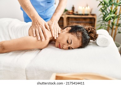 Middle Age Man And Woman Wearing Therapist Uniform Having Back Massage Session At Beauty Center