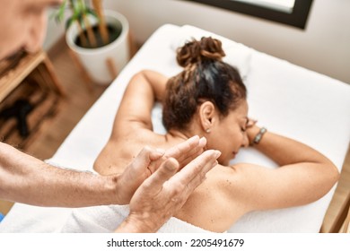 Middle Age Man And Woman Wearing Therapist Uniform Having Back Massage Session At Beauty Center