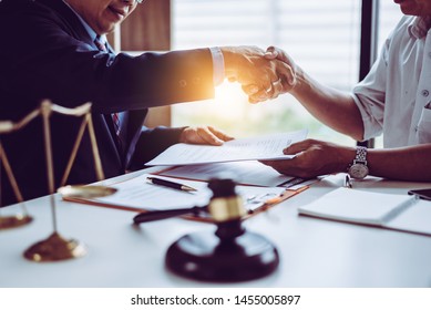 Middle Age Partner Lawyers Attorneys Shaking Hands After Discussing A Contract Agreement Done, Asian People.