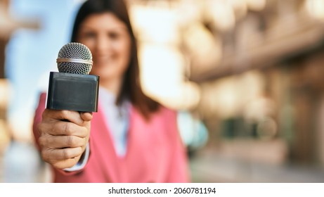 Middle Age Reporter Woman Holding Journalist Mic Close To The Camera, Close Up Of Professional Microphone.