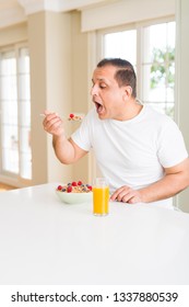 Middle Age Senior Man Eating Healthy Cereals For Breakfast