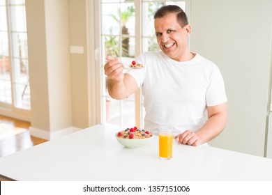 Middle Age Senior Man Eating Healthy Cereals For Breakfast