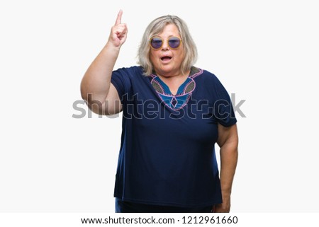 Middle age senior plus size woman wearing sunglasses over isolated background