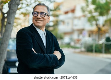 Middle Age Southeast Asian Man Smiling Confident With Crossed Arms At The City