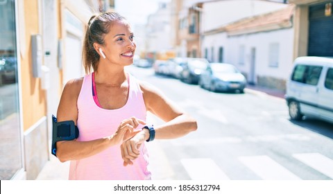 Middle Age Sportswoman Smiling Happy Training At The City