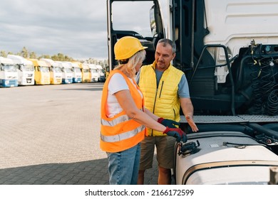 Middle Age Truck Driver Woman And Man Opens Gas Tank With Keys, Colleges Or Mechanic Worker 