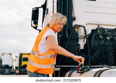 Middle Age Truck Driver Woman Opens Gas Tank With Keys 