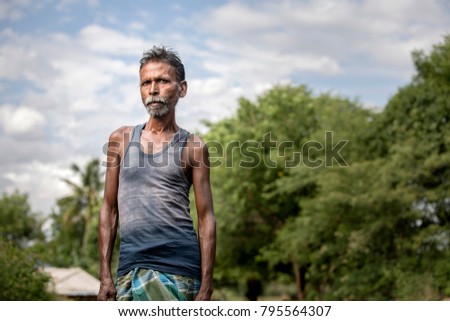 Middle age village man on nature outdoor background.