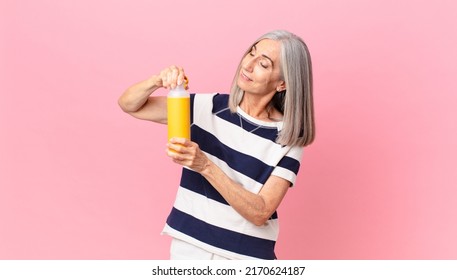 Middle Age White Hair Woman Holding A Coffee Thermos