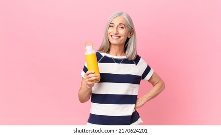 Middle Age White Hair Woman Holding A Coffee Thermos