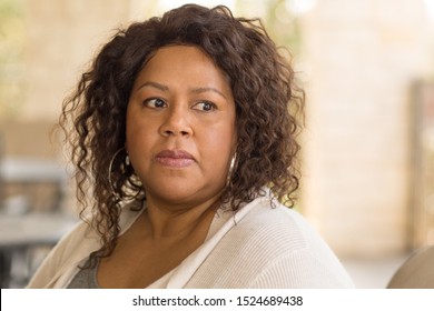 Middle age woman in deep thought. - Powered by Shutterstock