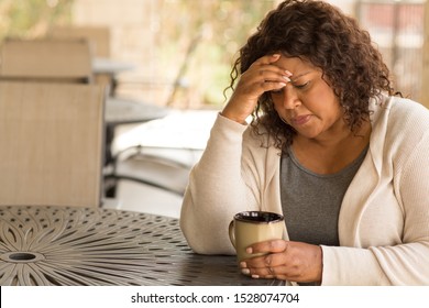 Middle age woman in deep thought - Powered by Shutterstock