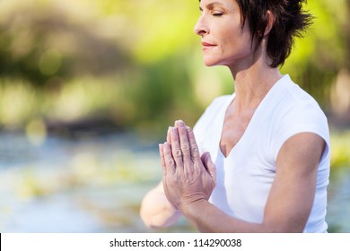 Middle Age Woman Doing Yoga Meditation