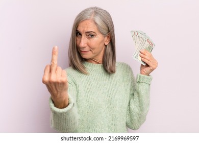 Middle Age Woman Feeling Angry, Annoyed, Rebellious And Aggressive. Dollar Banknotes Concept