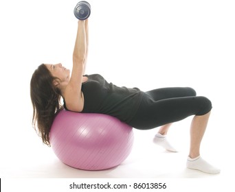 Middle Age Woman Fitness Exercising  Strength  Training With Dumbbell Weights Core Training Ball