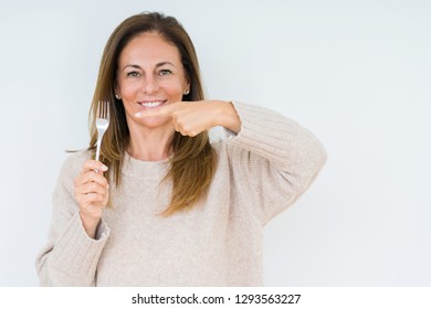 Middle Age Woman Holding Silver Fork Metal Over Isolated Background Very Happy Pointing With Hand And Finger