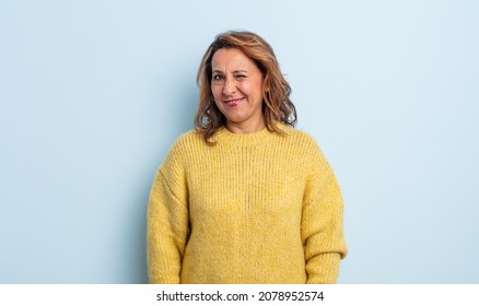 Middle Age Woman Looking Happy And Friendly, Smiling And Winking An Eye At You With A Positive Attitude