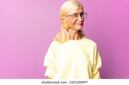 Middle Age Woman Looking Happy And Friendly, Smiling And Winking An Eye At You With A Positive Attitude