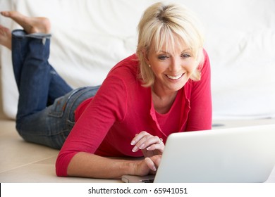 Middle Age Woman On Her Laptop Computer