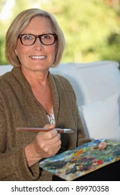 A Middle Age Woman Painting.