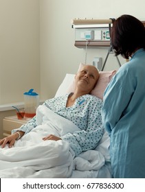 Middle Age Woman Patient With Cancer In Hospital On Oncology Department Visited By Her Girlfriend. She Hope In Healing.